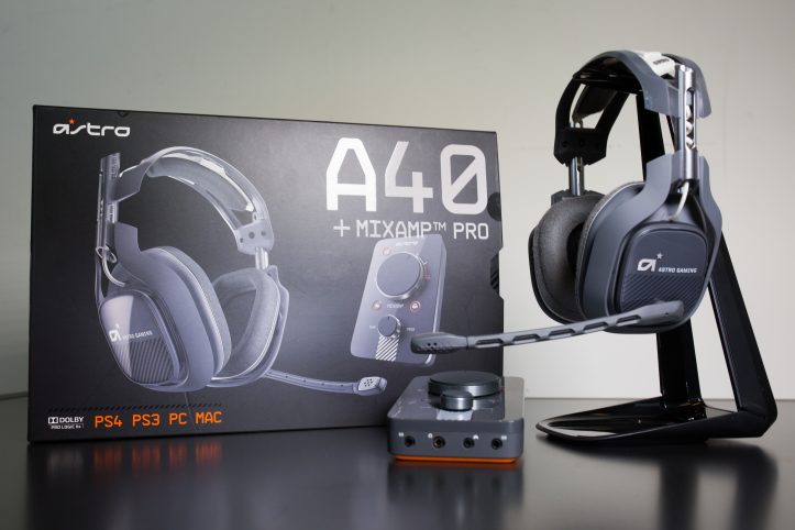 An Astro-branded pair of headphones and a box on a table.