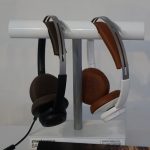 A pair of Plantronics BackBeat headphones on a stand.