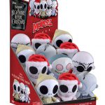 The Nightmare Before Christmas plush toys are displayed in a case.