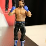 A Mattel toy figure of a wrestler is on display.