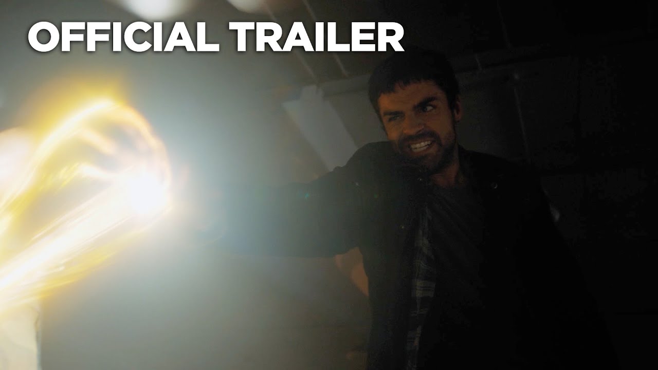The Gifted man is holding a flashlight in front of a dark room.