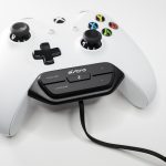 A white xbox one controller is connected to an ASTRO cable.