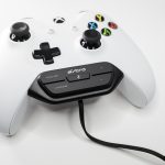 A white xbox one controller is connected to an ASTRO cable.