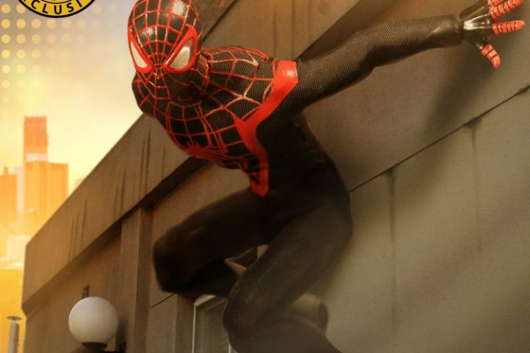 A Spider-Man figure is leaning against a building.