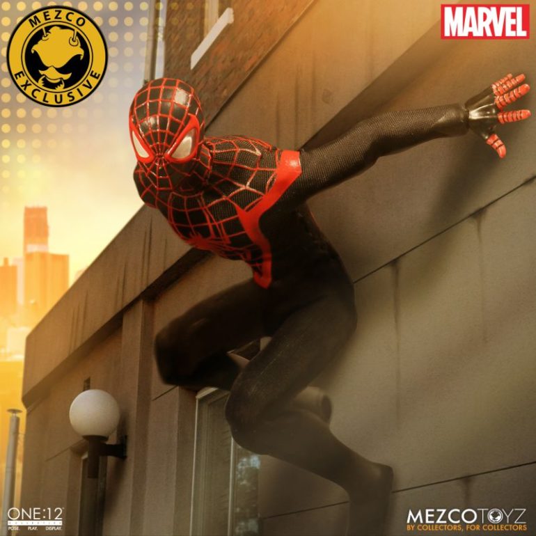 A Spider-Man figure is leaning against a building.