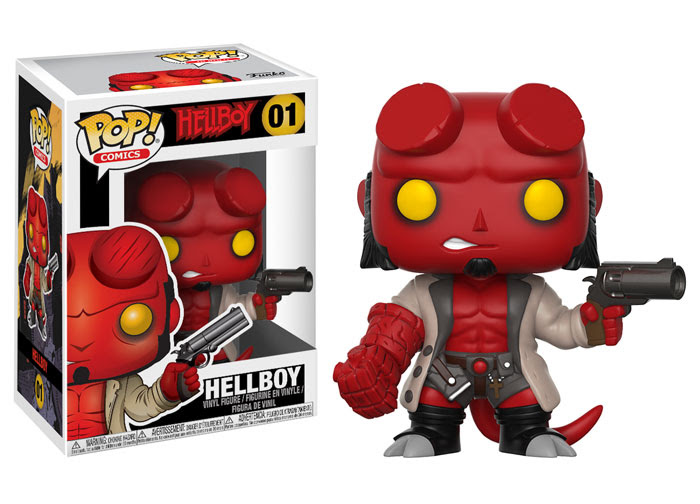 A pop vinyl figure of Hellboy wielding a gun.