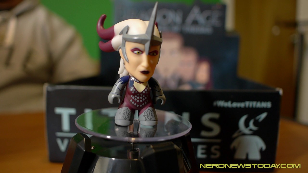 A Dragon Age figure resting within a box.