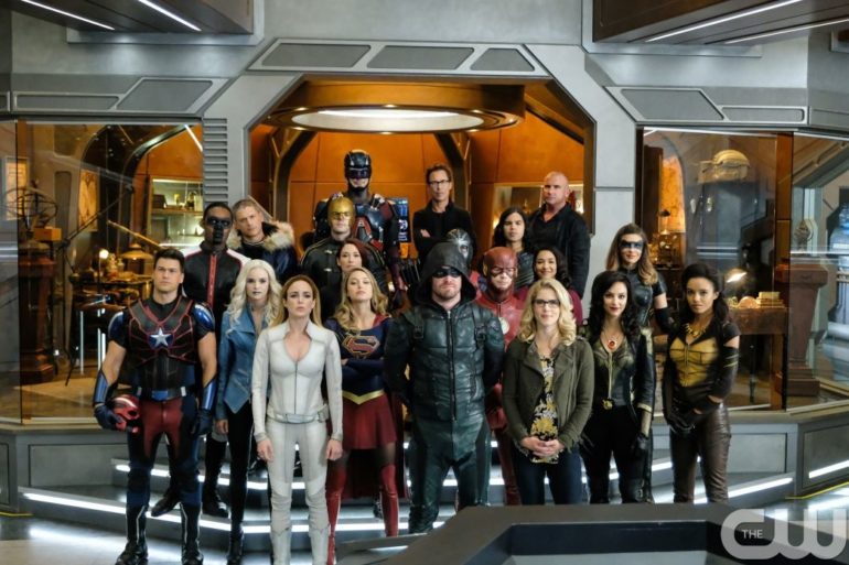 The cast of DC's Arrow is posing for a picture.