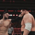 Two wrestlers engaging in an intense battle within the electrifying WWE 2K18 ring.