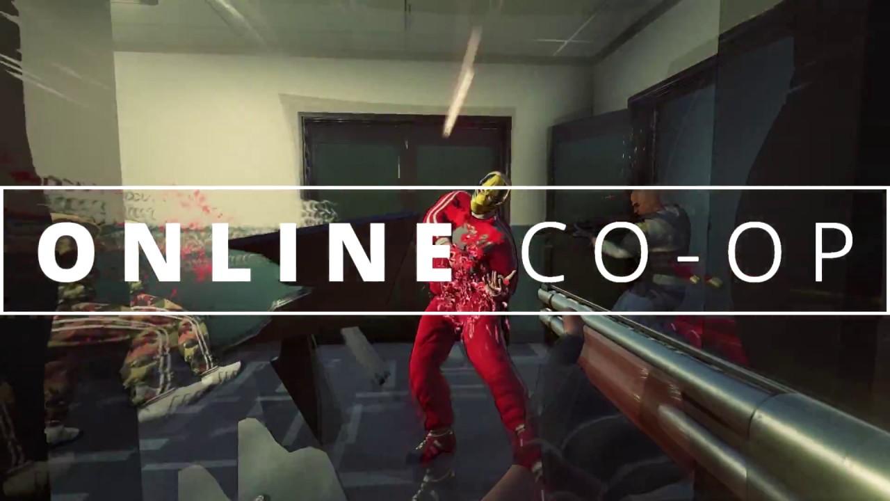 In a room with the words "online co-op," a man is securely gripping a gun.