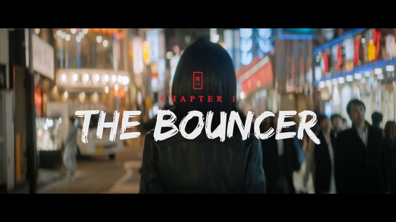 The bouncer with a woman walking down the street in Yakuza 6.