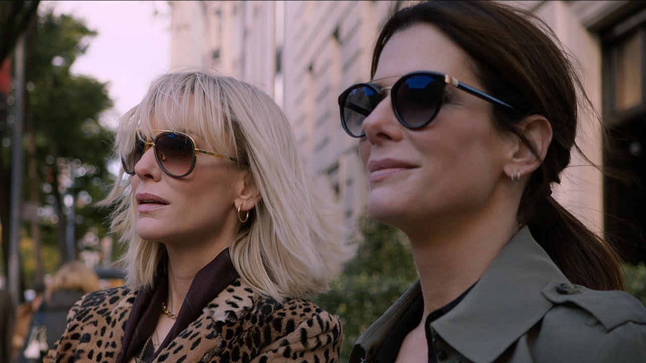 Two women in sunglasses standing next to each other, giving off a strong Ocean's 8 vibe.