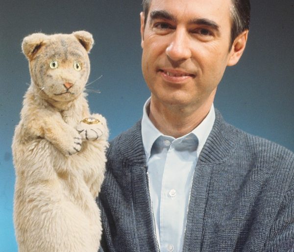 A man holding a stuffed animal in his hand, featured in the HBO documentary "Won't You Be My Neighbor?