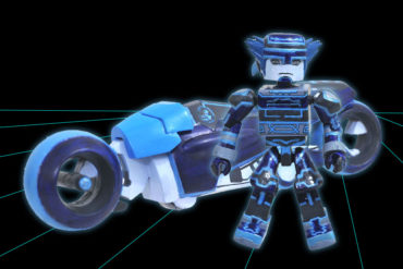 A Kingdom Hearts toy figure is standing next to a blue motorcycle.