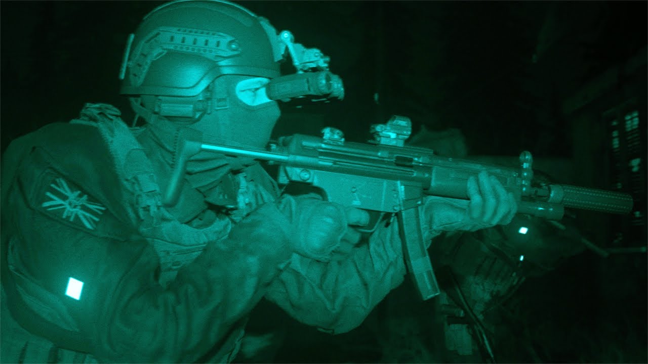 A soldier is holding a gun in the midst of Modern Warfare.