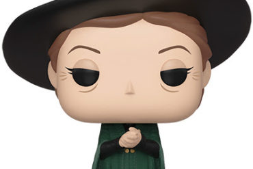 A Harry Potter Pop vinyl figure of a witch in a green hat.