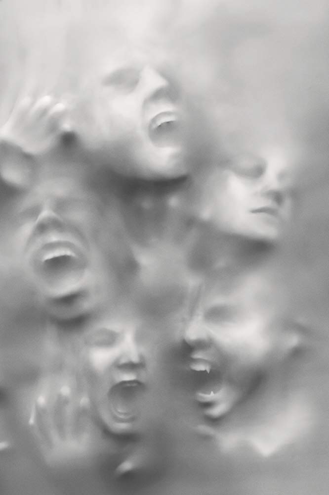 The official trailer for "New Mutants" offers a captivating first impression of a group of people with their mouths open in a striking black and white photo.