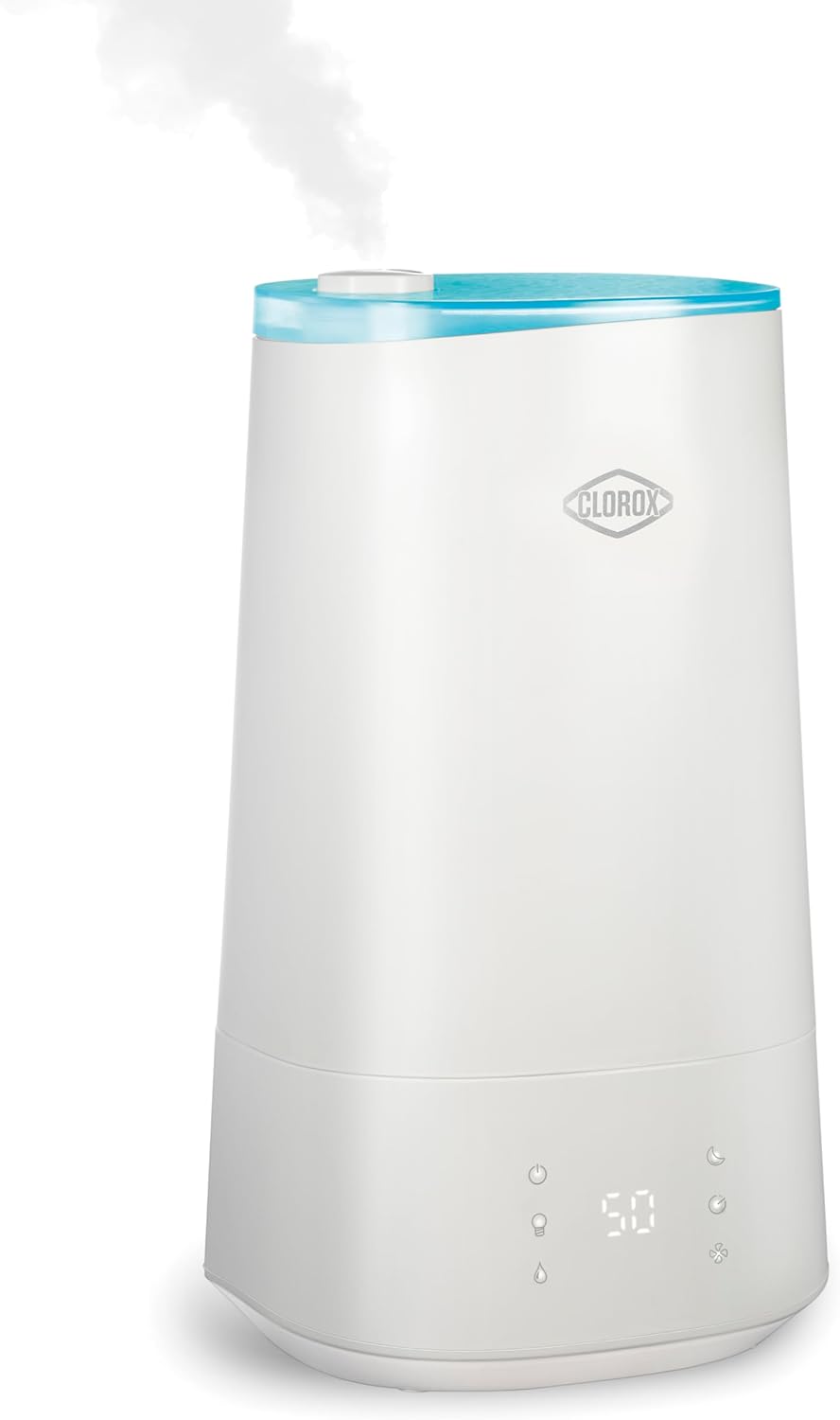 The white Clorox humidifier, featured in the RAGE Works Holiday Tech Gift Guide, emits steam and boasts a sleek digital display on the front.